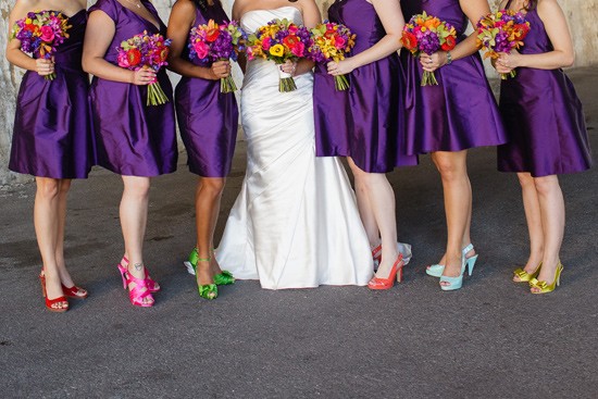 Bride and bridesmaids in purple dresses colorful shoes
