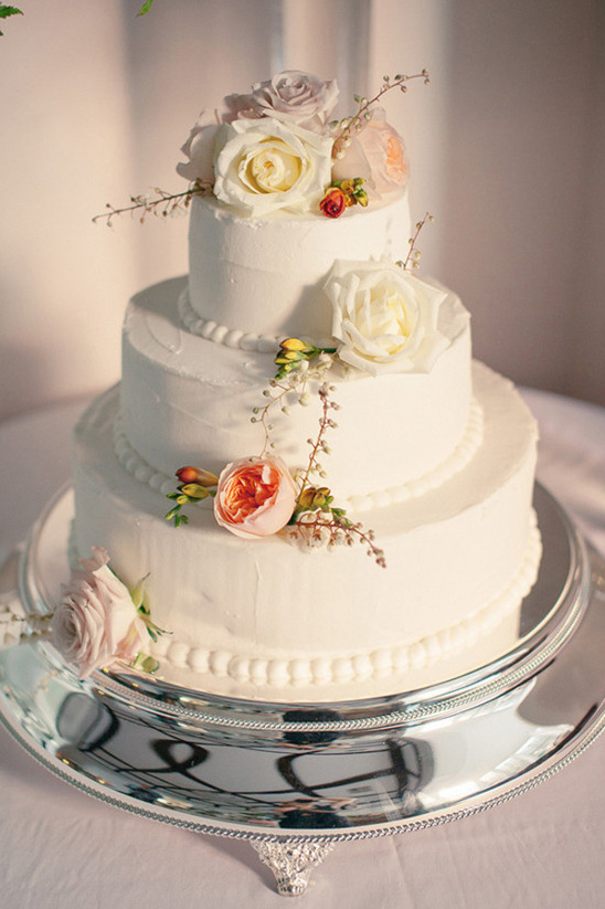wedding cake with pastel florals