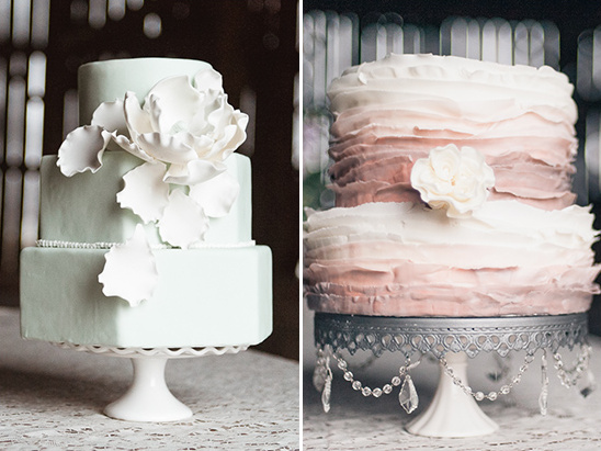 Two elegant wedding cakes on decorative stands