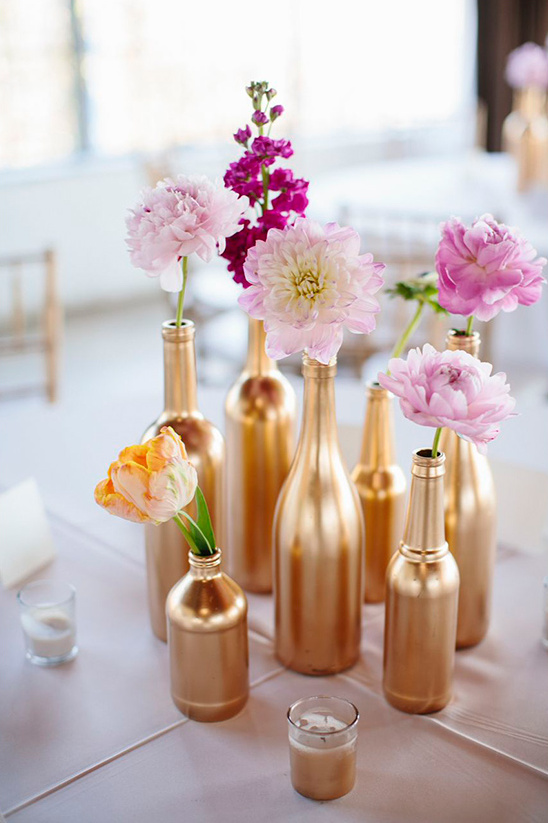 gold painted bottles make pretty flower vases