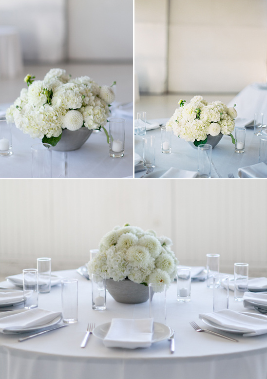 elegant white centerpieces at white tables