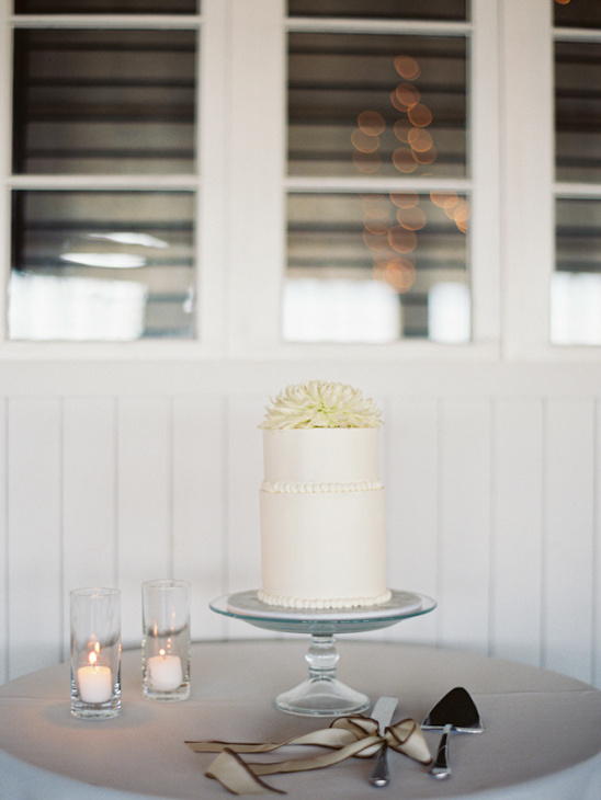 wedding cake table with simple white wedding cake