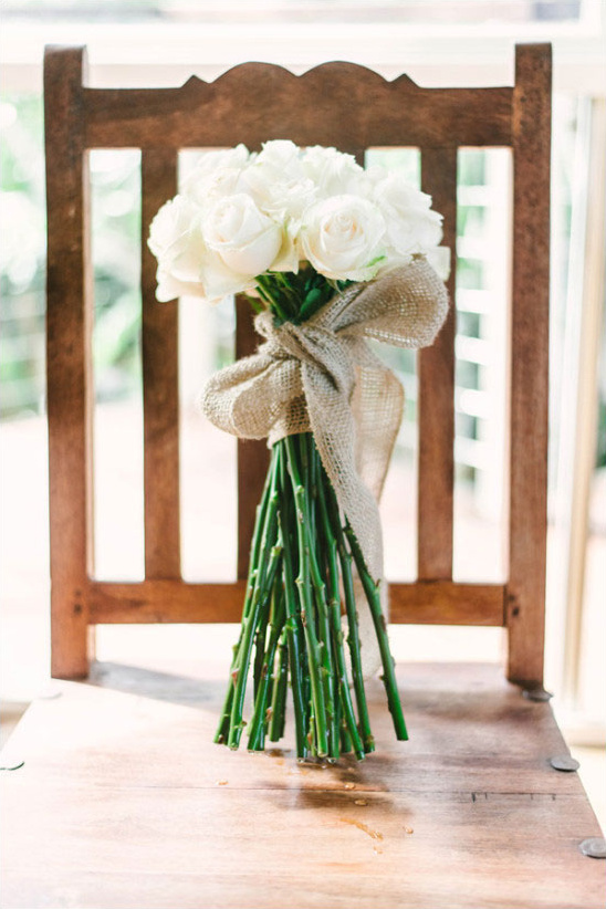 long stem white rose bouquet tied with burlap