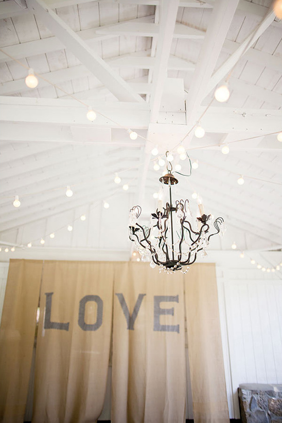 chandelier and love backdrop