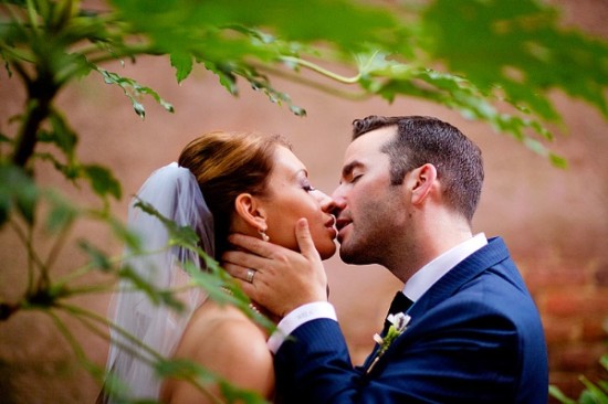Bride and groom sharing a kiss on their wedding day