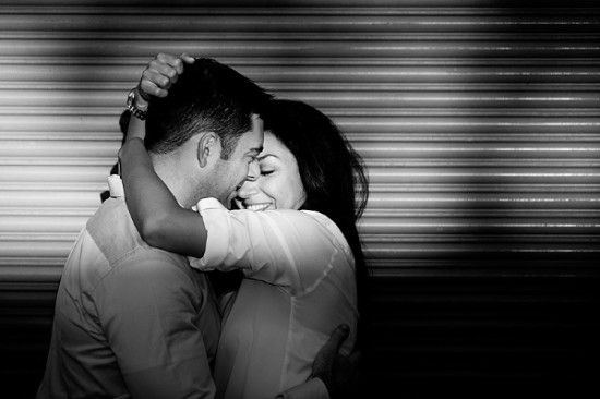 Happy couple embracing and smiling in black and white photo