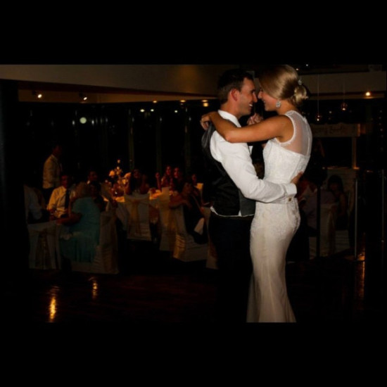 Bride and groom share a dance at their wedding
