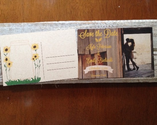 Rustic save the date card with sunflowers and couple kissing