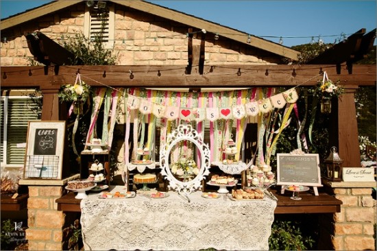 Rustic outdoor dessert table with cakes and pastries