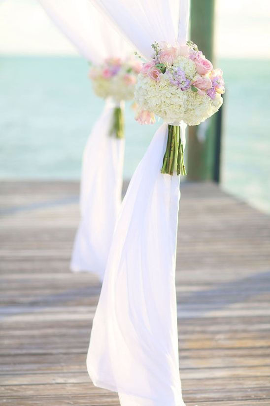 floral bouquet decor on wedding arch