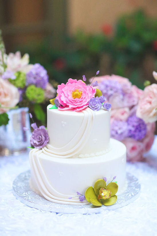 pink and purple accented wedding cake