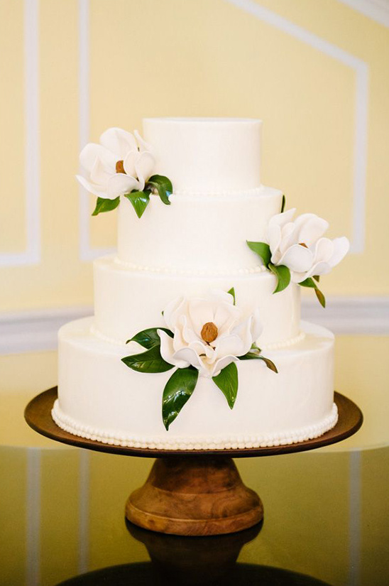 white flower accented wedding cake