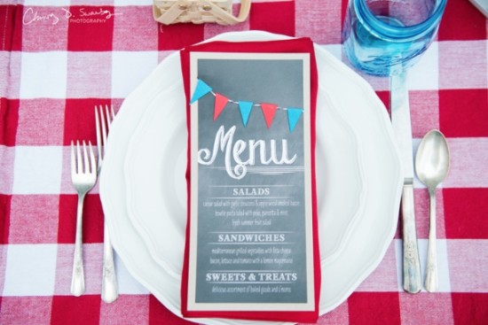 Festive menu on a plate at a picnic setting closeup