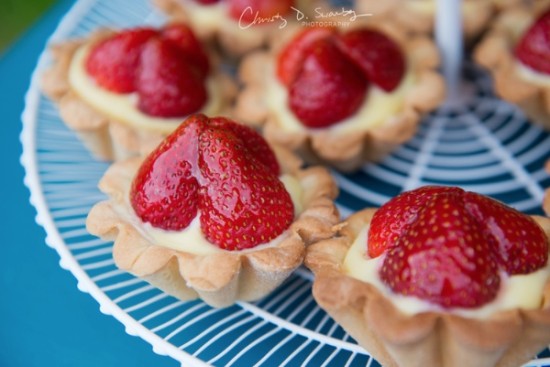Fresh strawberry tarts dessert on white display rack