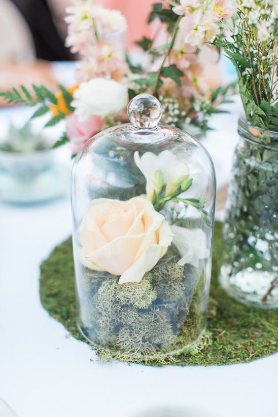 floral centerpiece in bell jar