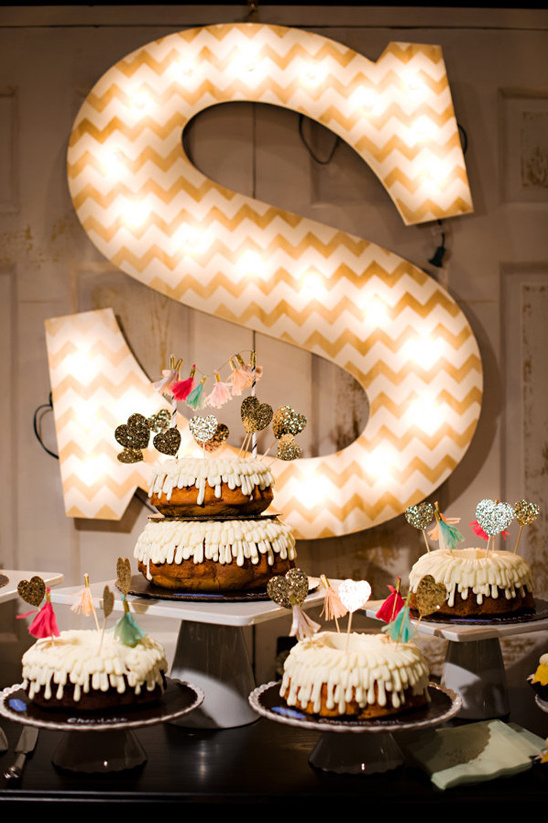 glowing letter S cake table backdrop