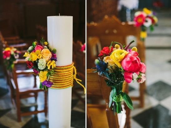 Wedding aisle decor, floral bouquet on candle and chairs
