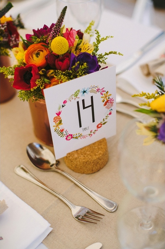 Wedding table setting with flowers and number fourteen