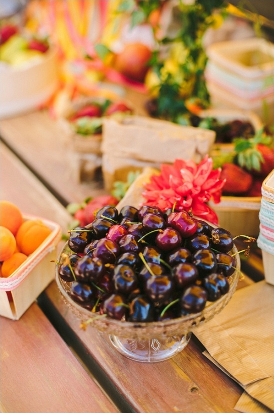 Bright summer picnic table with cherries and apricots