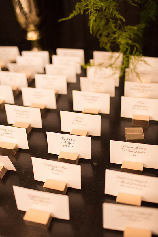 escort cards held by gold cubes