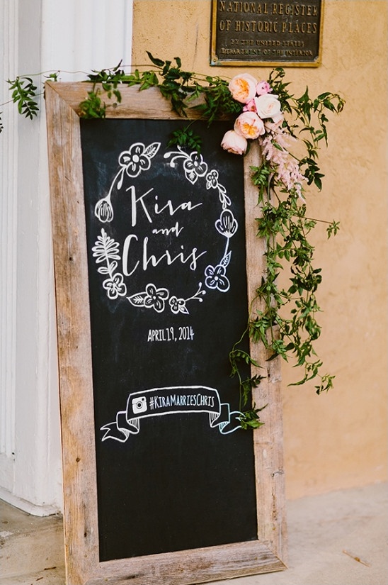Rustic wedding welcome sign for Kira and Chris on chalkboard