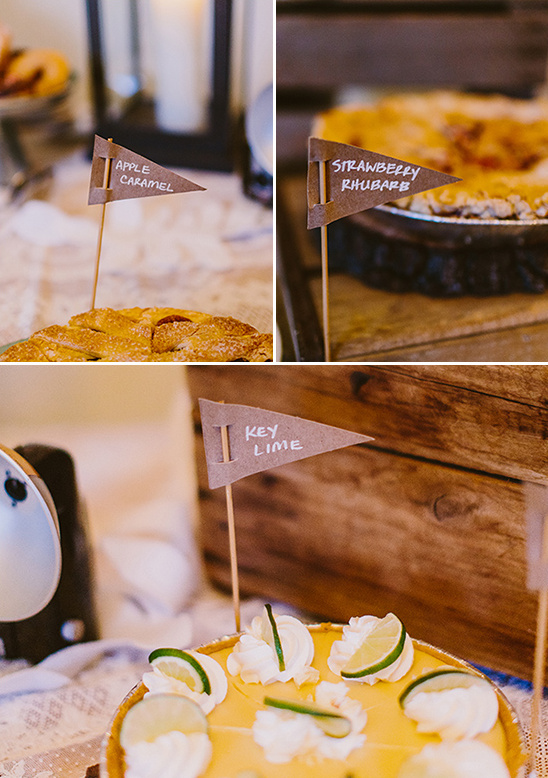Assorted pies with charming flavor flags dessert table