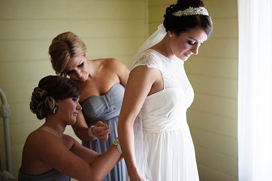 Bride gets ready with her bridesmaids on her wedding day