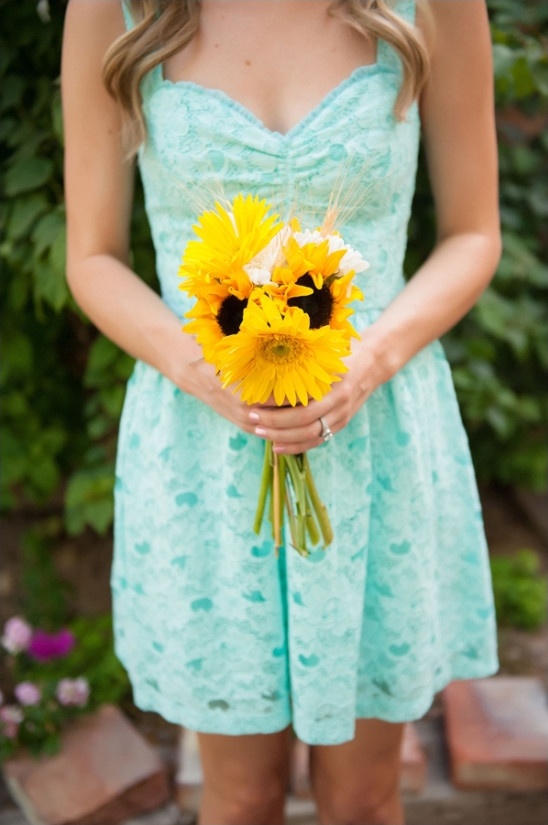 mint bridesmaids with sunflower bouquet