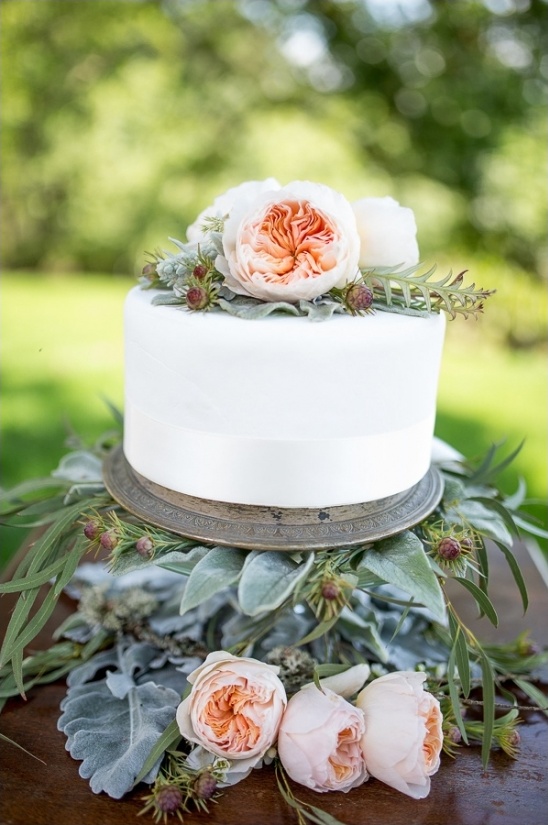 simple white cake with garden rose topper