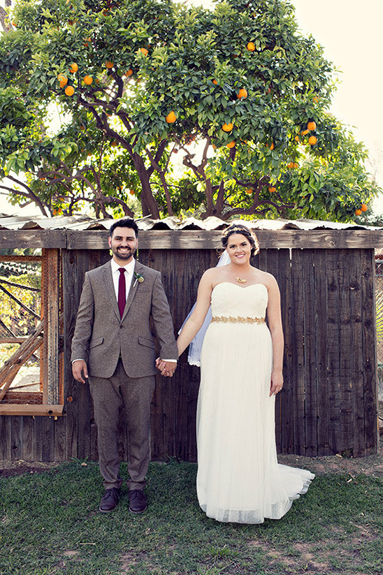 Bride and groom at their outdoor orange grove wedding