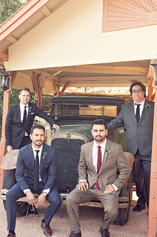 groomsmen on vintage car