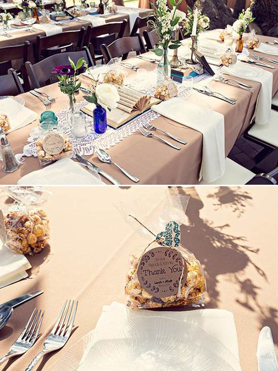 Rustic wedding reception table setting with popcorn favors