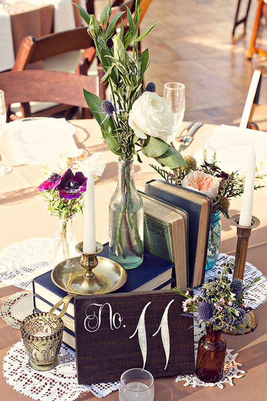 Table setting with books flowers candles and number eleven