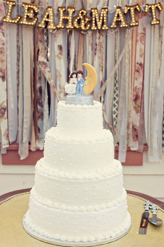 wedding cake with couple on the moon topper