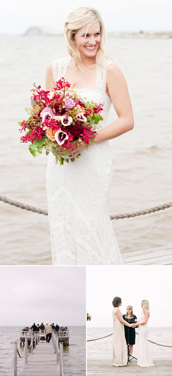 Smiling bride holds bouquet at outdoor wedding by water