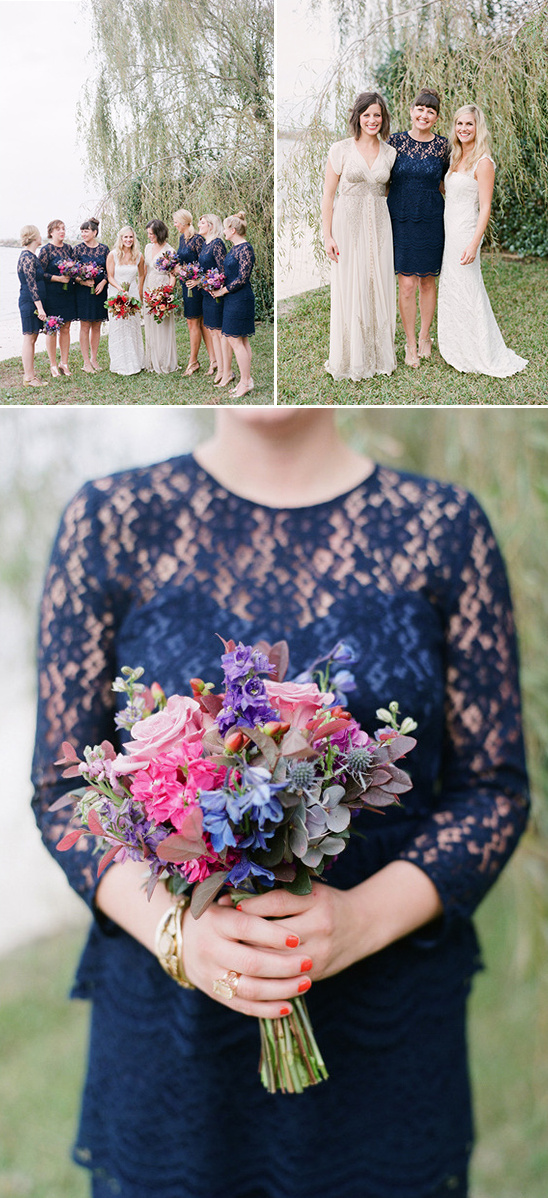 bridesmaids in navy with pink purple and blue bouquets