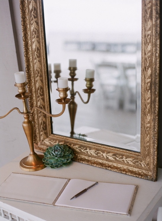 Elegant wedding guest book with golden mirror decor