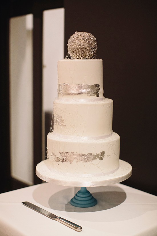 Elegant three tier wedding cake with silver accents