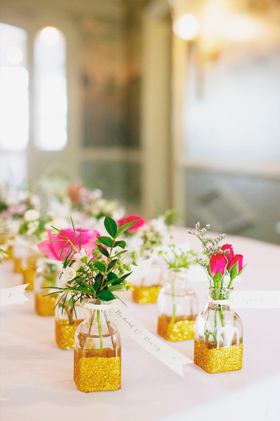 Wedding table decor with gold glitter vases and flowers