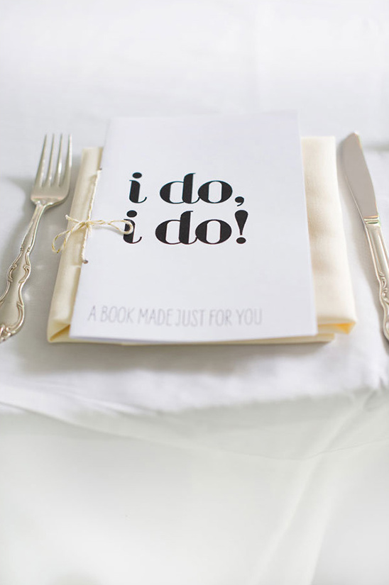 Wedding place setting with a personalized I do I do book