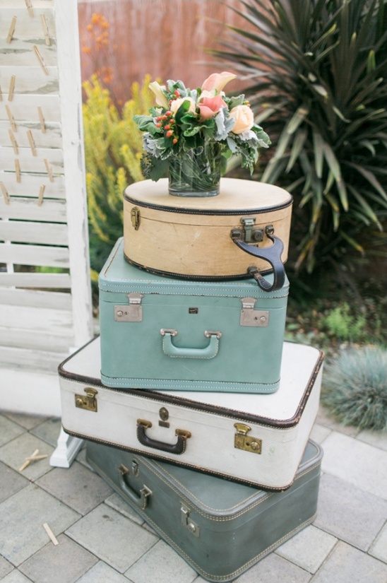 Stacked vintage suitcases with a floral arrangement