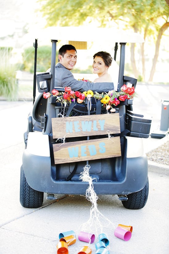 newlyweds golf cart getaway
