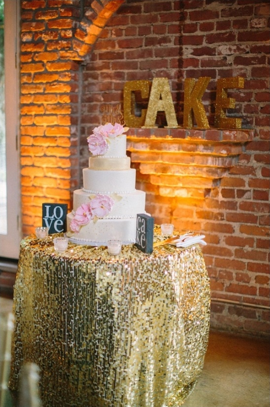 Elegant wedding cake with gold sequins table cloth