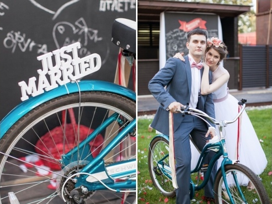 Happy newlyweds celebrate wedding with Just Married bicycle