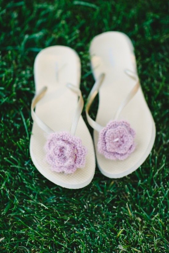 Floral adorned flip flops on green grass summer style