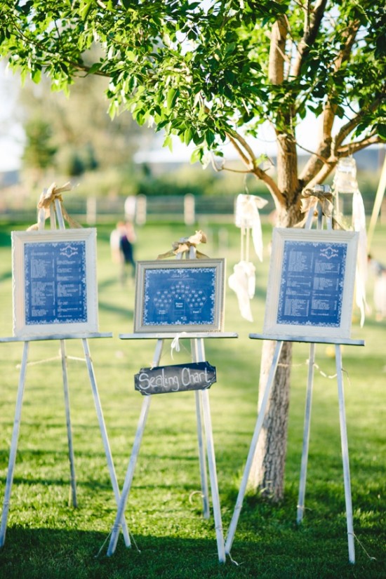 Outdoor wedding seating chart display on easels