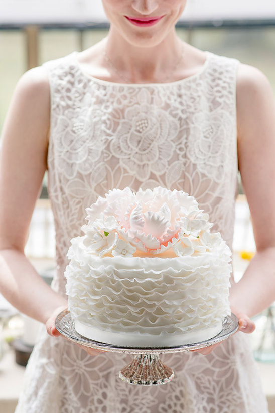 ruffled white shimmer wedding cake
