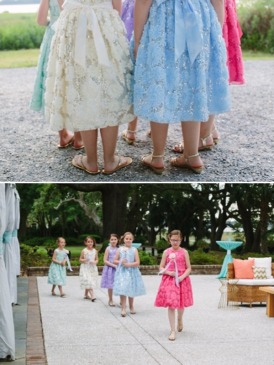 Flower girls in colorful dresses at outdoor wedding