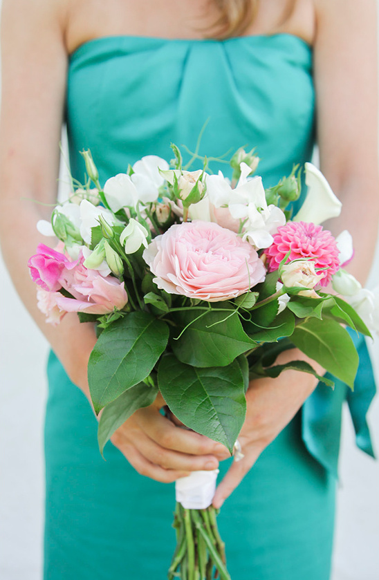 Woman holding a beautiful bouquet of pink and white flowers