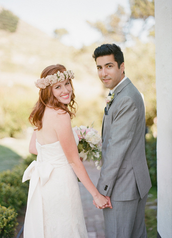 Happy bride and groom holding hands on their wedding day
